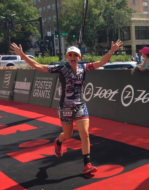 Heather crossing the finish line