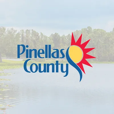Pinellas County logo over a faded photo of a lake with trees
