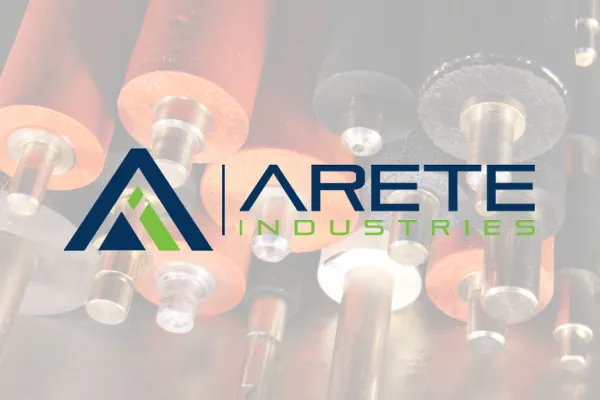 Arete Industries logo over faded industrial machinery