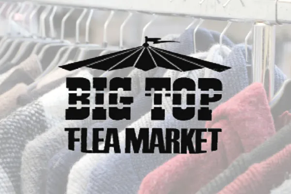 Big Top Flea Market logo over a rack of clothing
