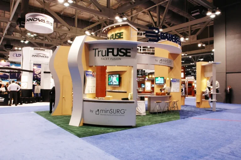 Two level trade show booth with TruFuse sign in a convention hall