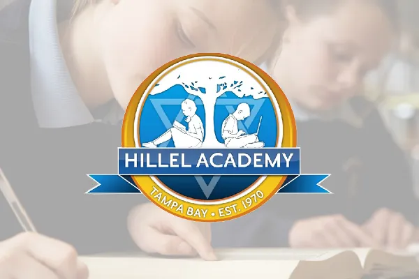 Hillel Academy logo over a faded photo of a child writing