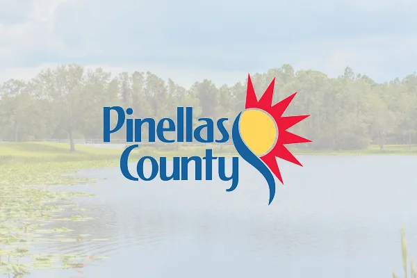 Pinellas County logo over a faded lakeside photo