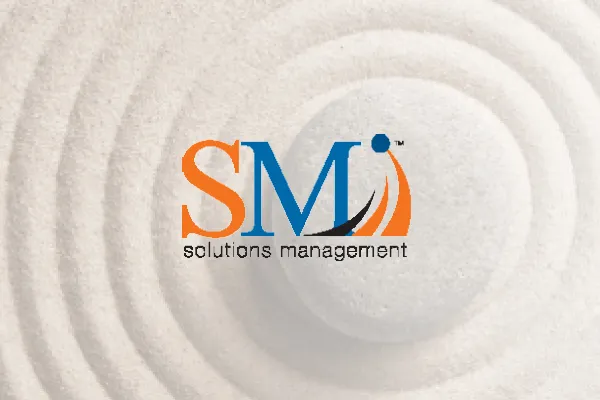 SMI solutions management logo over a raked sand pattern