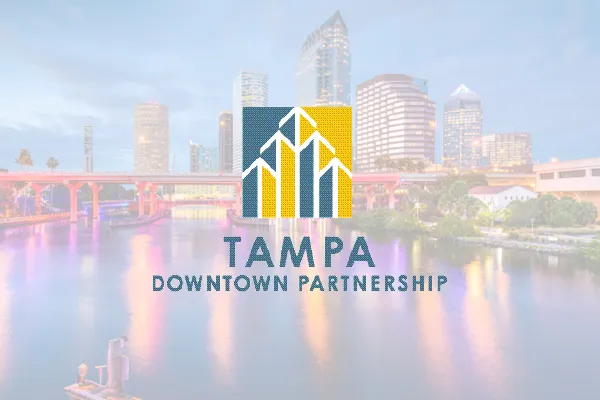 Tampa Downtown Partnership logo over a dusk photo of the riverfront skyline