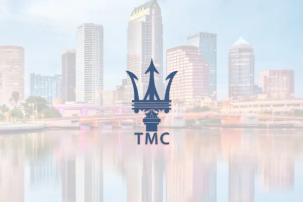 The Maserati Club TMC trident logo over the Tampa skyline