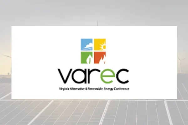 VAREC logo on a white panel over solar panels and wind turbines