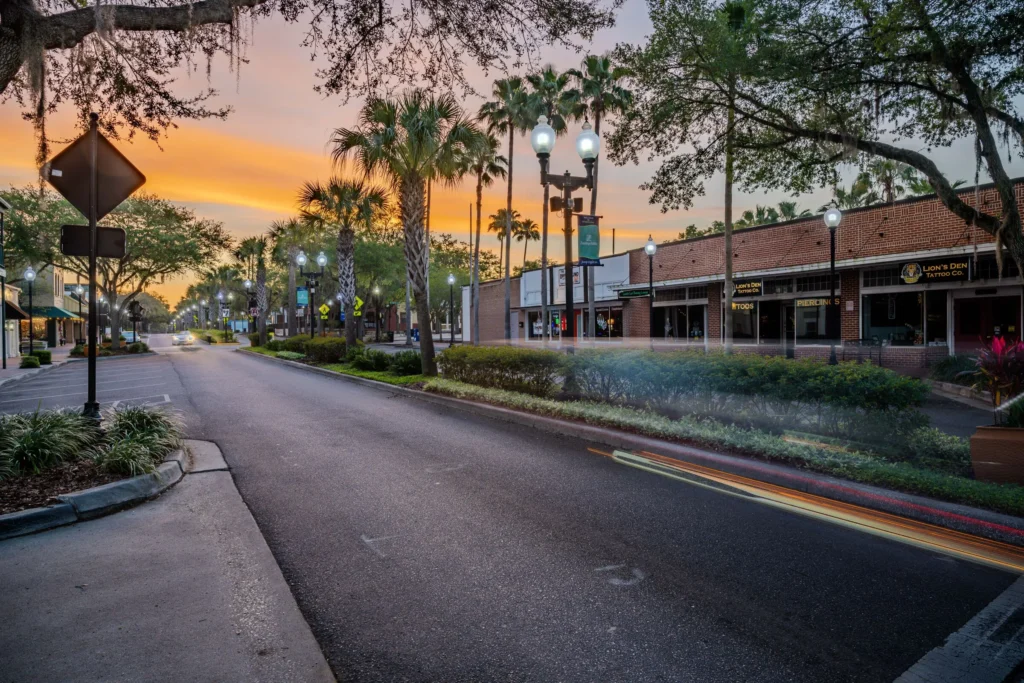 Zephyrhills downtown street at sunset with palm trees and storefronts