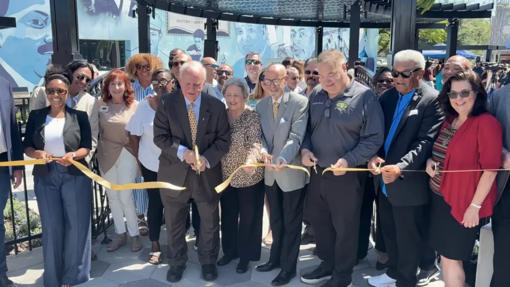 Community leaders cut the ribbon at a West Tampa redevelopment project, from the Tampa CRA Redevelopment Week video