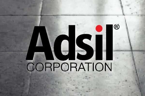 Adsil Corporation logo on a dark concrete background