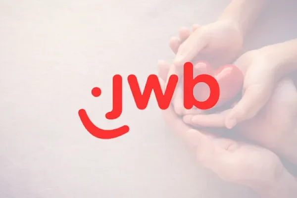 JWB logo over a faded photo of hands holding hands