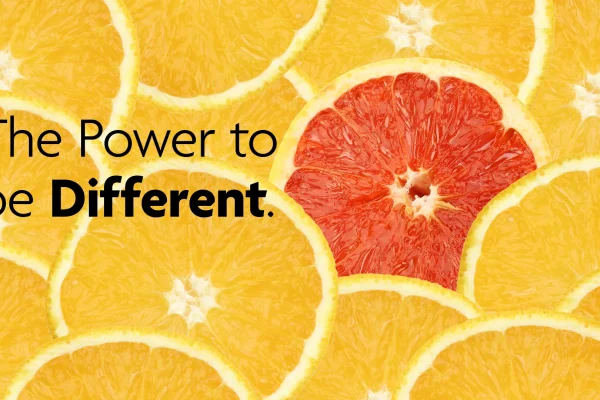 Digital ad reading The Power to be Different, a red grapefruit slice among orange slices