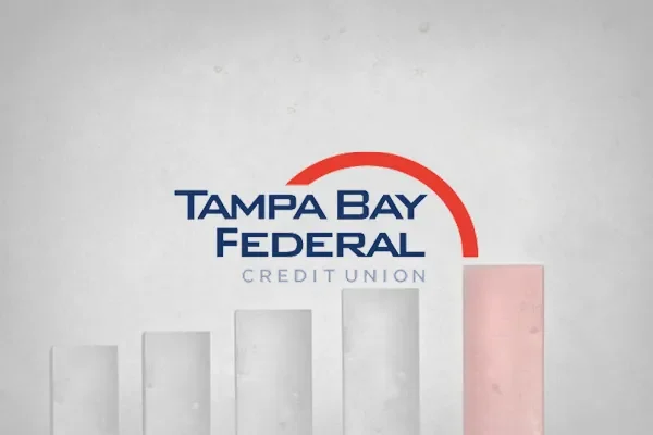 Tampa Bay Federal Credit Union logo over a rising bar chart