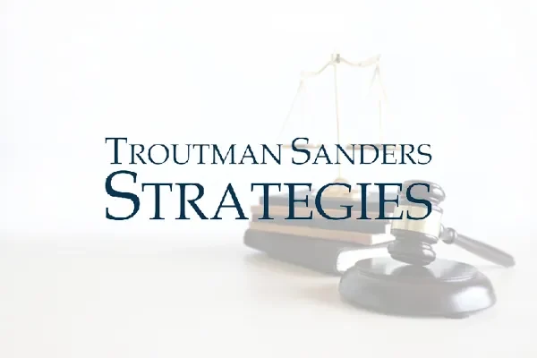 Troutman Sanders Strategies logo over a gavel and scales