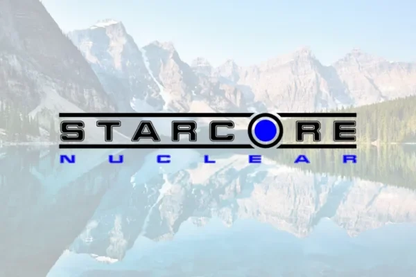 StarCore Nuclear logo over a faded mountain lake photo